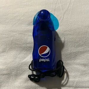 New in box PEPSI hand fan.  Shrink wrapped batteries included,  likely expired.